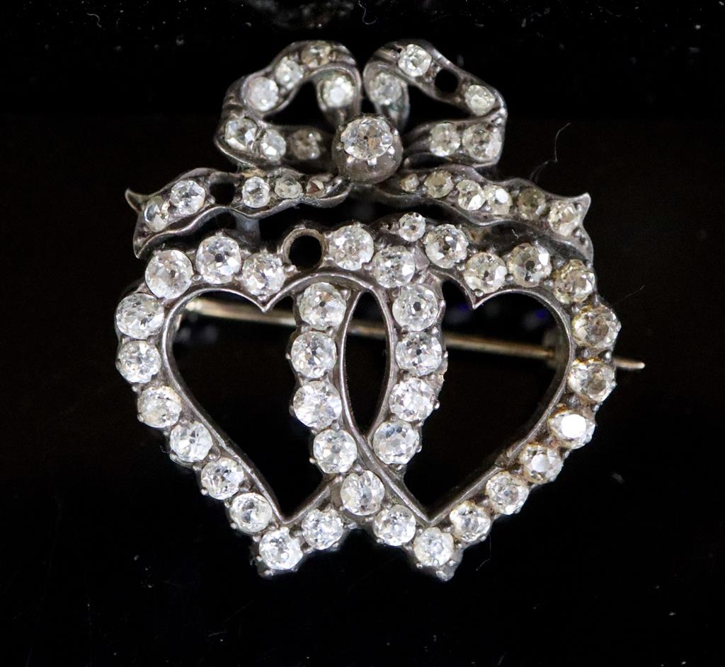 A Victorian gold, silver and diamond cluster set entwined twin hearts brooch,